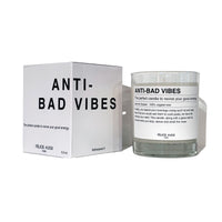 scented candle with the writing "anti-bad vibes" and funny description on